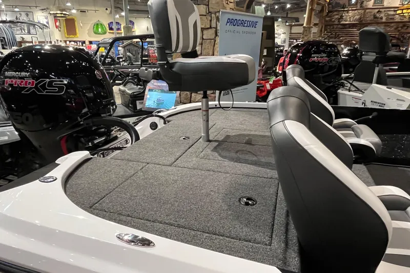 Slide: The Image of 2025 Nitro Z18 boat interior with Mercury Pro XS engine, featuring comfortable seating and carpeted deck. - 9