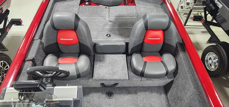 Slide: The Image of 2025 Tracker Pro Team 190 boat interior with dual gray and red seats. - 10