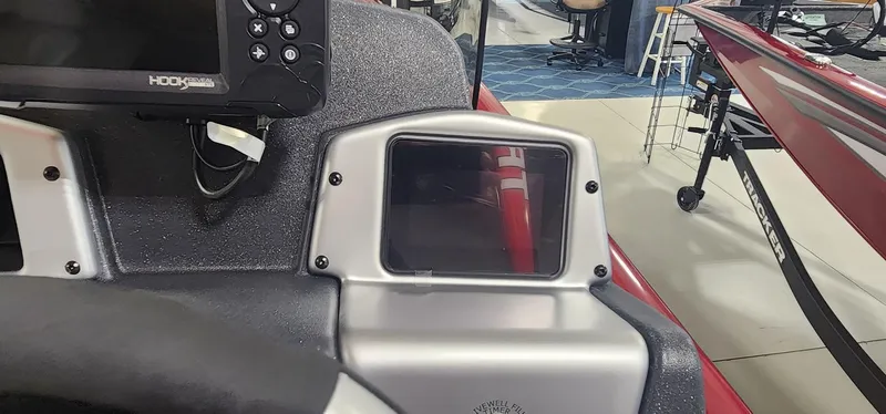 Slide: The Image of Control panel of 2025 Tracker Pro Team 190 boat with electronic display and steering wheel. - 12
