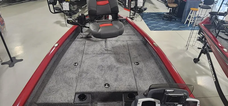 Slide: The Image of 2025 Tracker Pro Team 190 boat interior with gray carpet and red accents. - 6