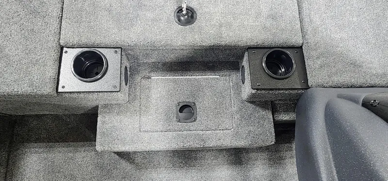 Slide: The Image of 2025 Tracker Pro Team 190 boat interior with cup holders and storage compartments. - 8