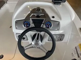 Slide: The Image of Steering console of 2025 Tahoe 1950 boat with modern controls and gauges. - 3