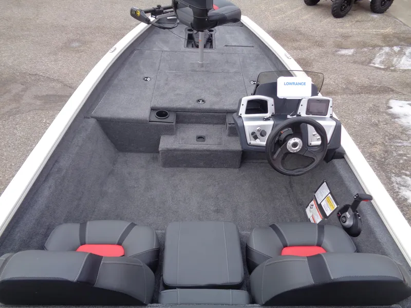 Slide: The Image of 2025 Tracker Pro Team 175 boat interior with steering console and seating. - 6