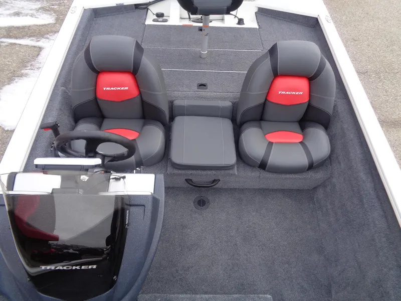 Slide: The Image of 2025 Tracker Pro Team 175 boat interior with dual seats and steering console. - 7
