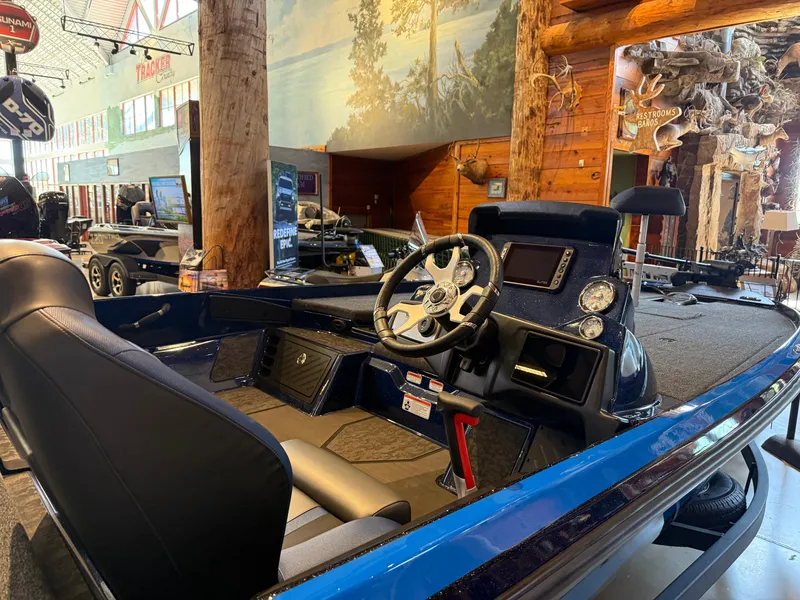 Slide: The Image of 2025 Nitro Z21 XL boat interior with modern dashboard and steering wheel. - 2