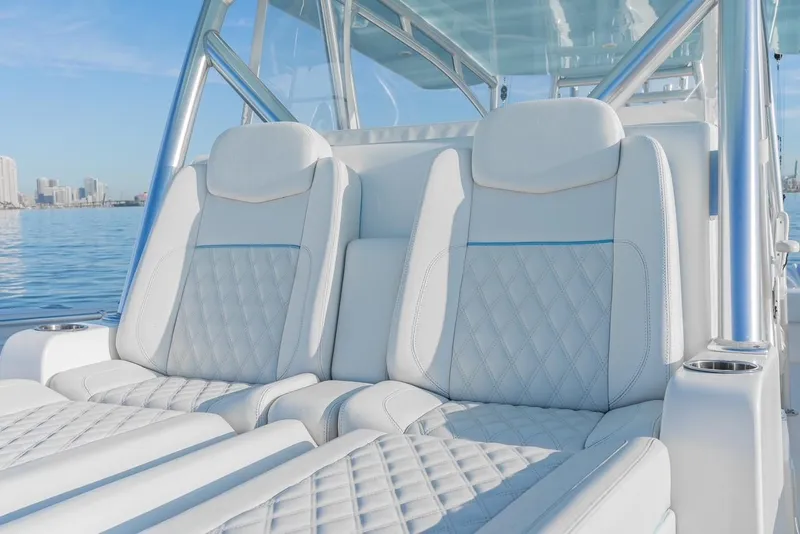 Slide: The Image of Luxurious seating on 2022 SeaHunter 46 CTS boat with quilted white upholstery. - 16