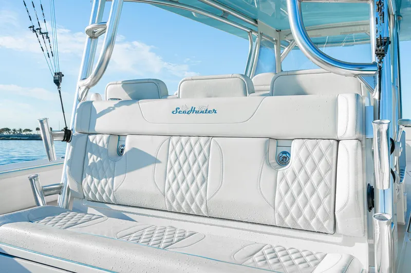 Slide: The Image of 2022 SeaHunter 46 CTS boat with luxurious white seating and diamond stitching. - 17