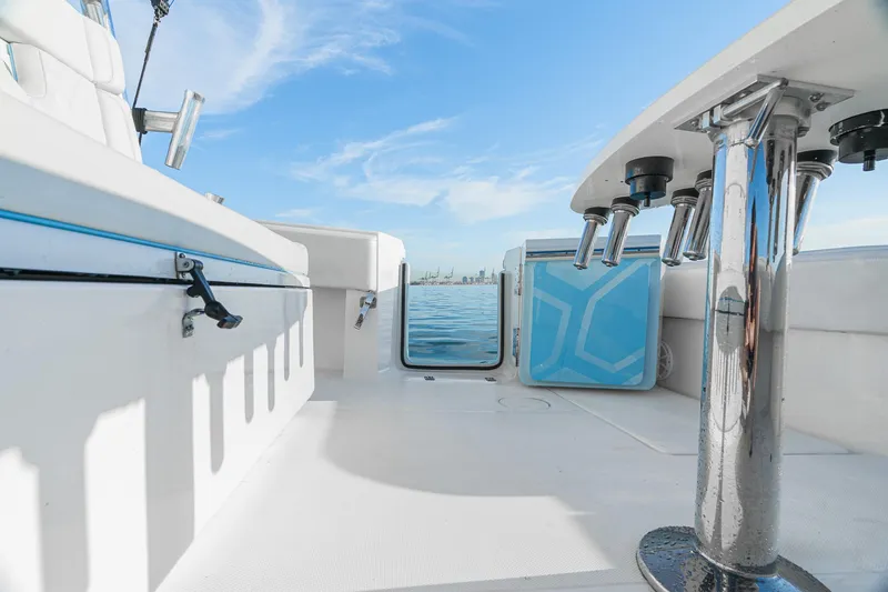 Slide: The Image of 2022 SeaHunter 46 CTS boat interior with ocean view and fishing rod holders. - 21