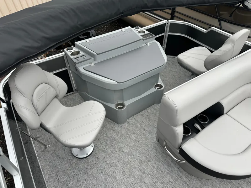 Slide: The Image of 2025 Trifecta 22 TRFCLE pontoon boat interior with gray seating and helm station. - 9