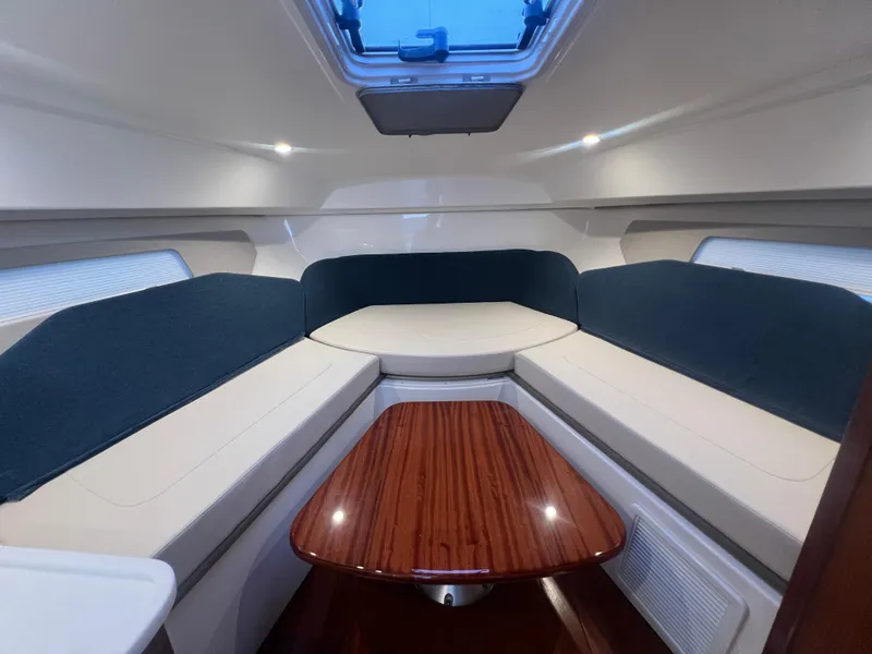 Slide: The Image of 2025 Pursuit OS 325 Offshore boat seat with quilted upholstery and speaker. - 13