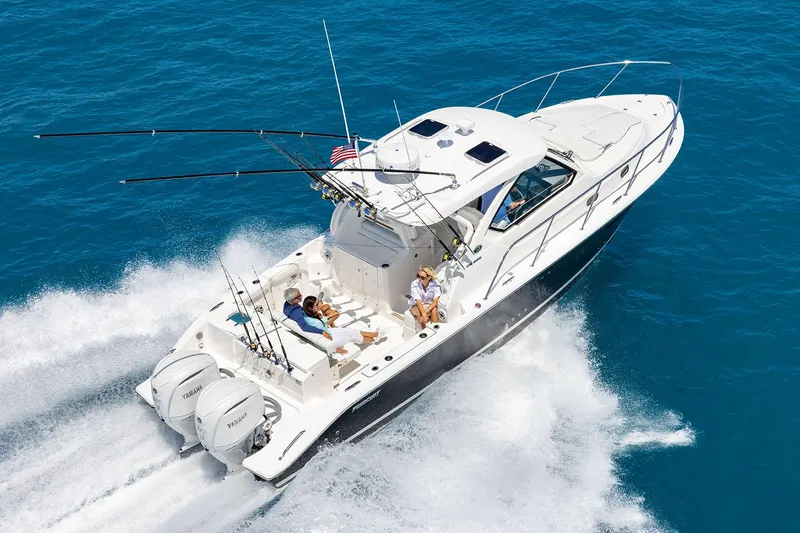 Slide: The Image of 2025 Pursuit OS 325 Offshore boat seat with quilted upholstery and storage compartments. - 2