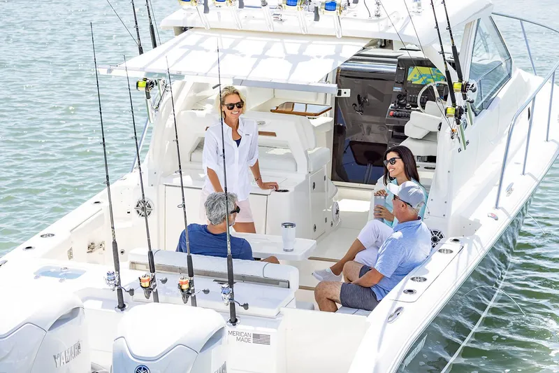 Slide: The Image of 2025 Pursuit OS 325 Offshore boat seat with quilted gray upholstery. - 3