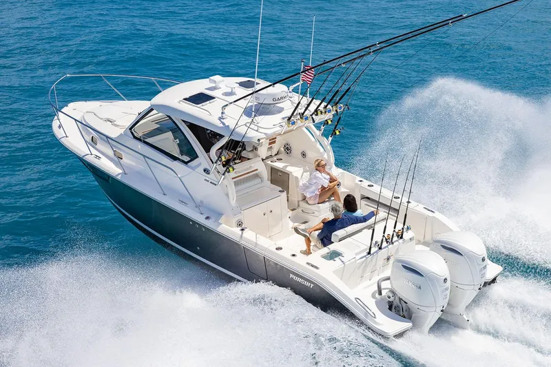 Slide: The Image of 2025 Pursuit OS 325 Offshore boat interior with storage compartment and fresh water access. - 4