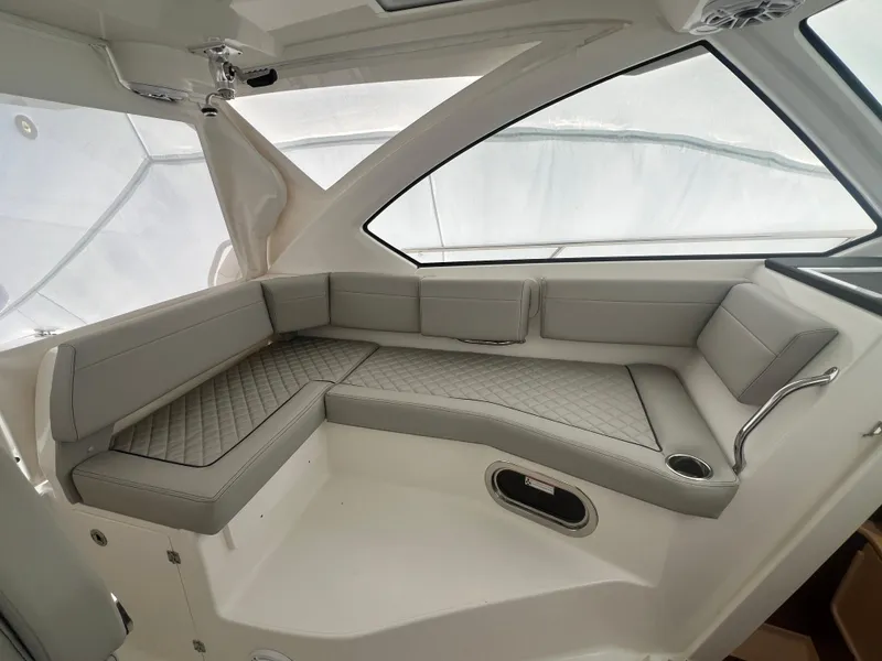 Slide: The Image of 2025 Pursuit OS 325 Offshore interior with sleek, modern seating and elegant design. - 42