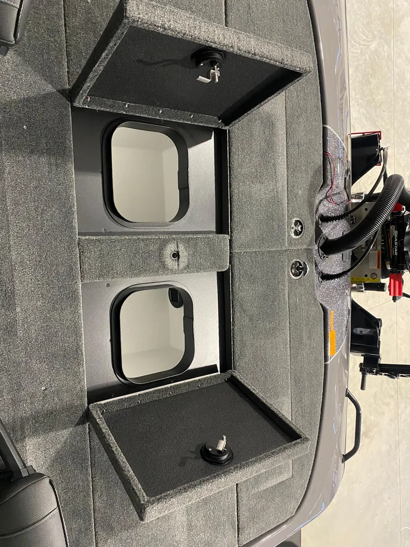 Slide: The Image of 2025 Skeeter ZXR21 boat interior with open storage compartments. - 10