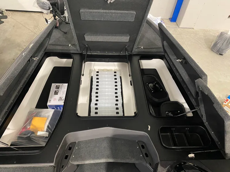 Slide: The Image of 2025 Skeeter ZXR21 boat storage compartments and seating area. - 5