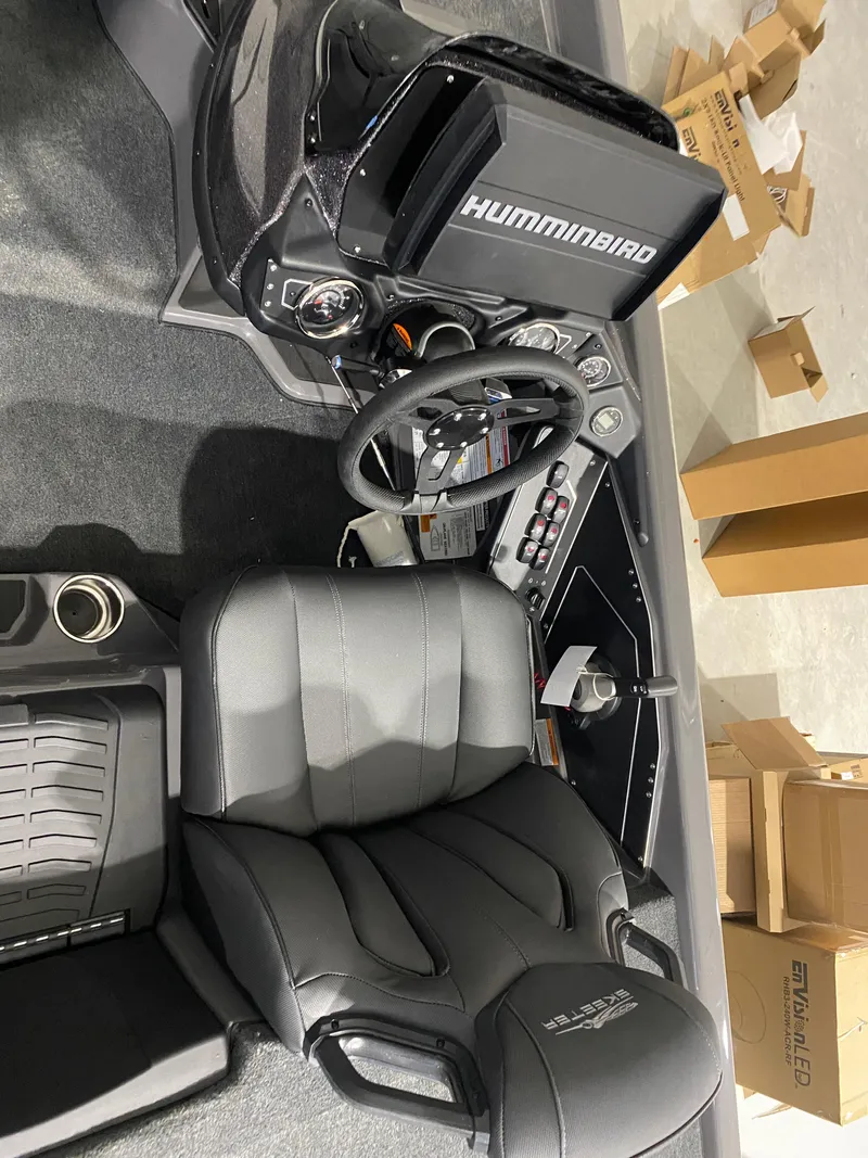 Slide: The Image of 2025 Skeeter ZXR21 boat cockpit with Humminbird electronics and sleek black seating. - 7