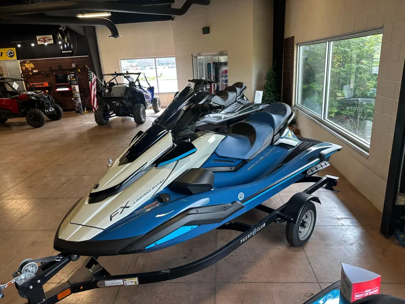 Slide: The Image of 2025 Yamaha WaveRunner FX Limited SVHO in showroom, blue and white, on trailer. - 7