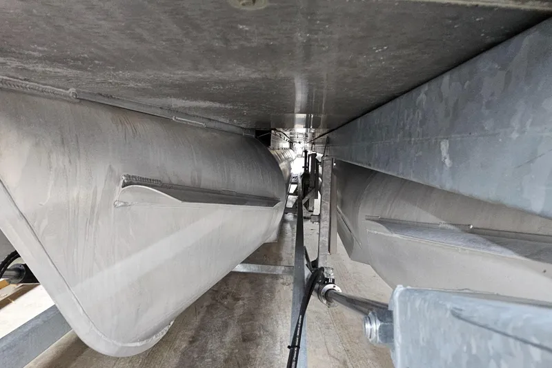 Slide: The Image of Underneath view of 2022 Sweetwater 2286 pontoon boat, showcasing pontoons and structural details. - 10