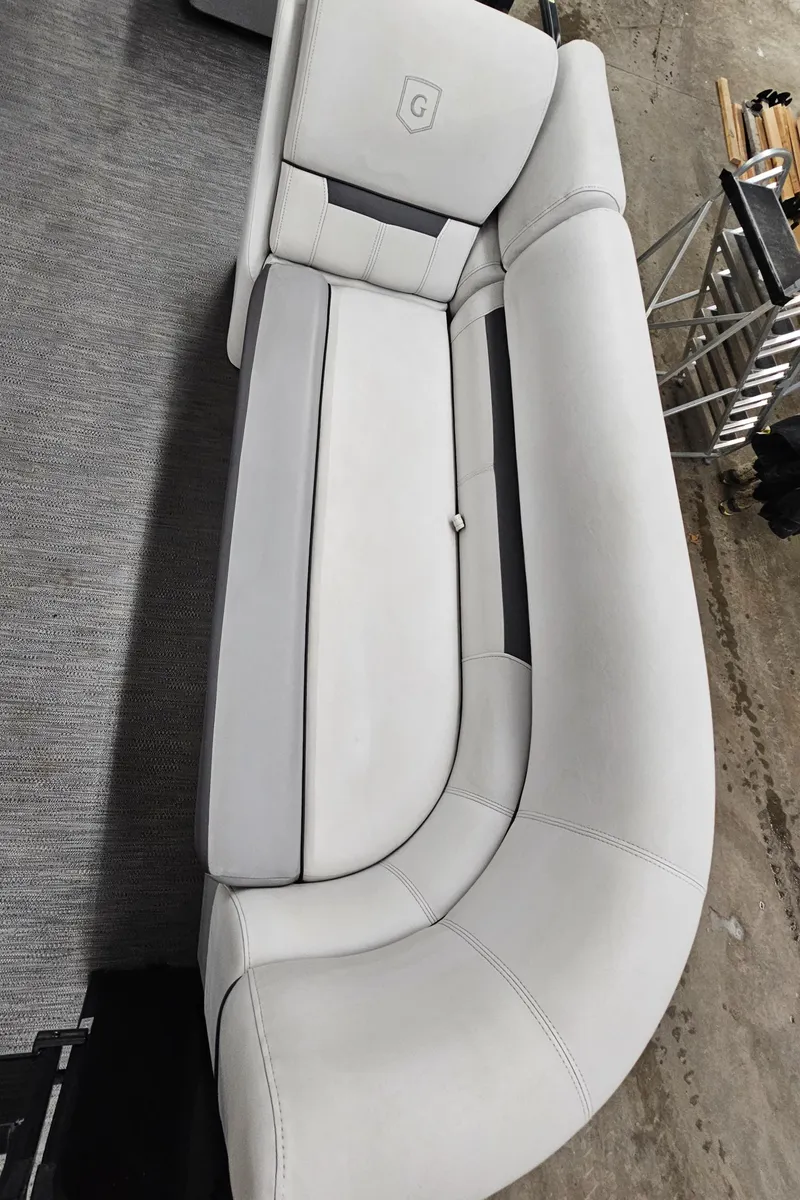 Slide: The Image of 2022 Sweetwater 2286 boat seat, light gray upholstery, modern design. - 13