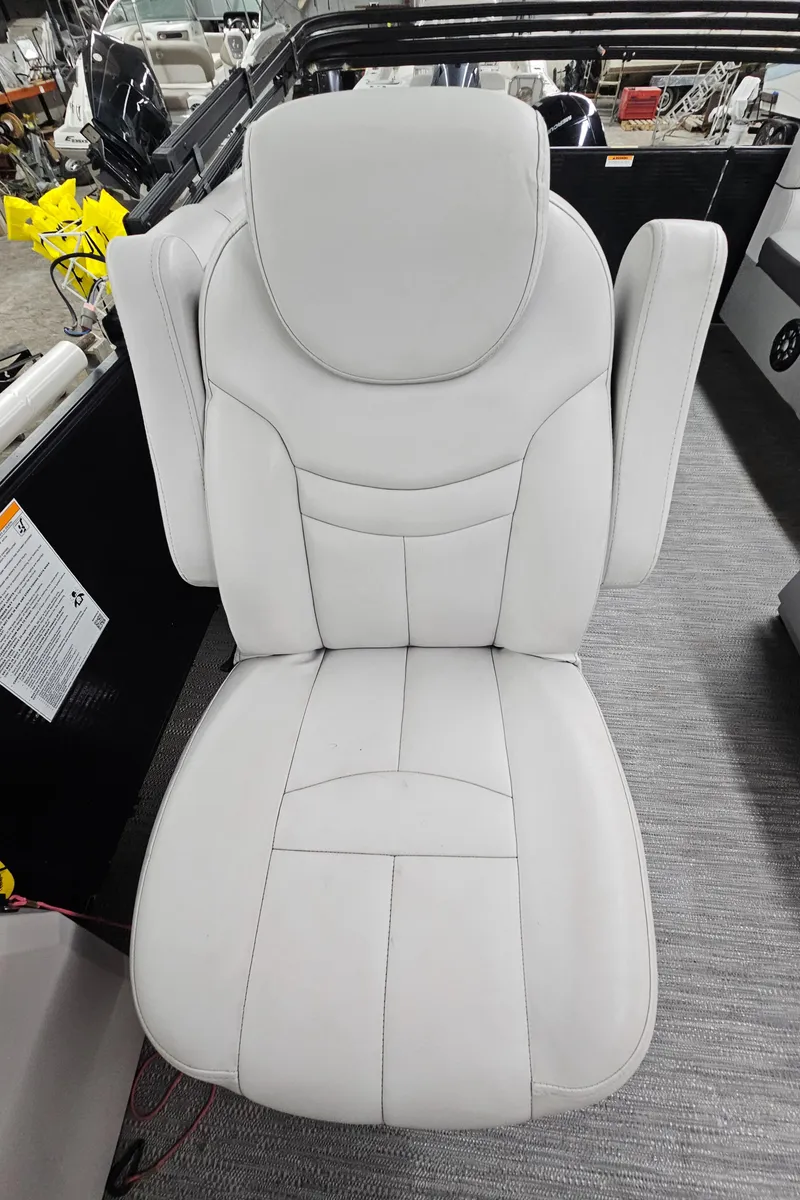 Slide: The Image of 2022 Sweetwater 2286 boat seat, white upholstery, modern design. - 16