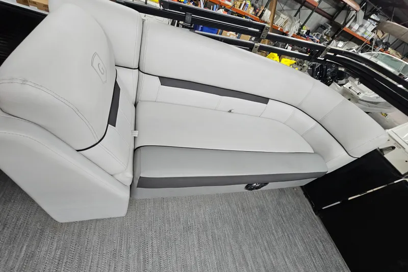 Slide: The Image of 2022 Sweetwater 2286 boat interior with gray cushioned seating. - 18