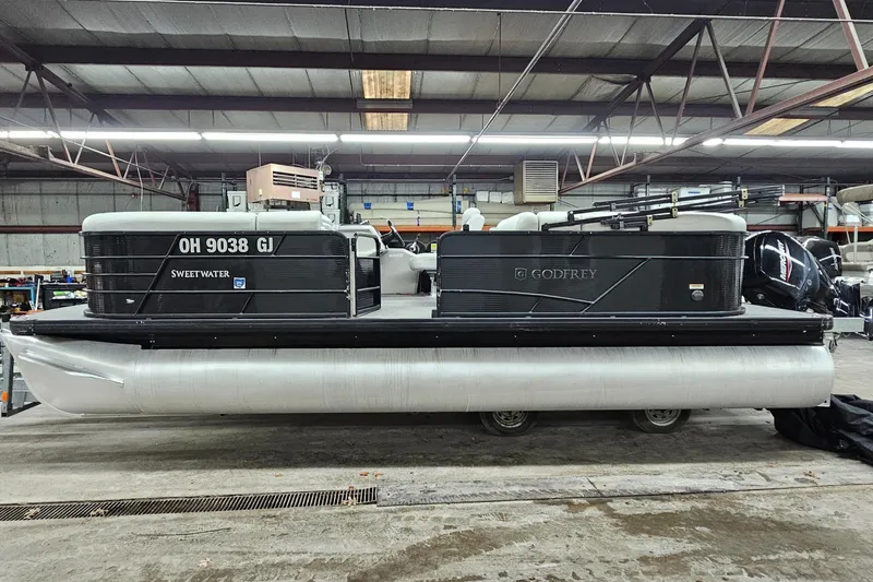 Slide: The Image of 2022 Sweetwater 2286 pontoon boat in a warehouse setting. - 3
