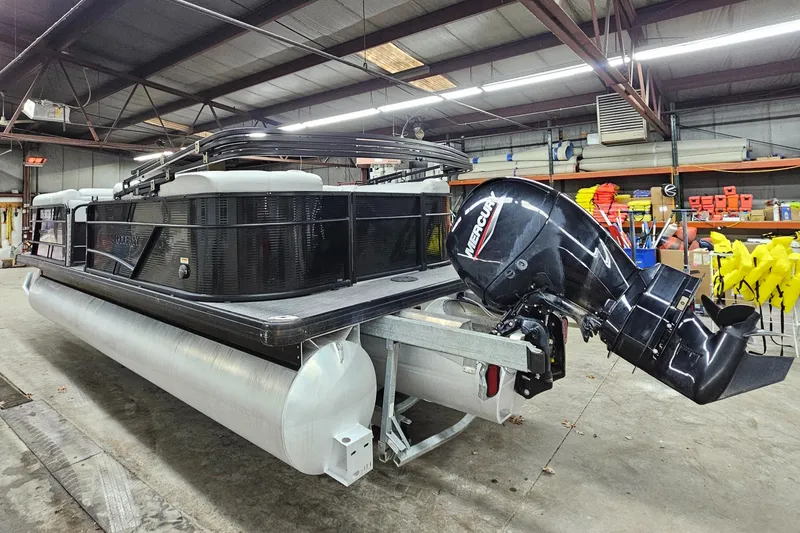 Slide: The Image of 2022 Sweetwater 2286 pontoon boat with Mercury outboard motor in a warehouse. - 4