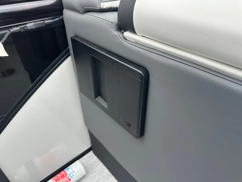 Slide: The Image of Interior detail of 2025 Trifecta 23 RFESS boat, featuring sleek panel design. - 12