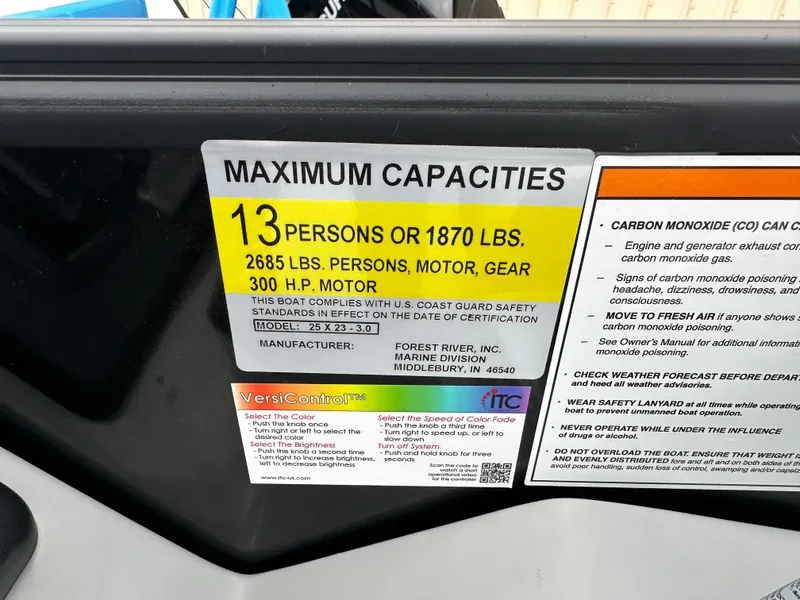 Slide: The Image of Capacity label for Trifecta 23 RFESS 2025 boat: 13 people, 1870 lbs, 300 HP motor. - 13