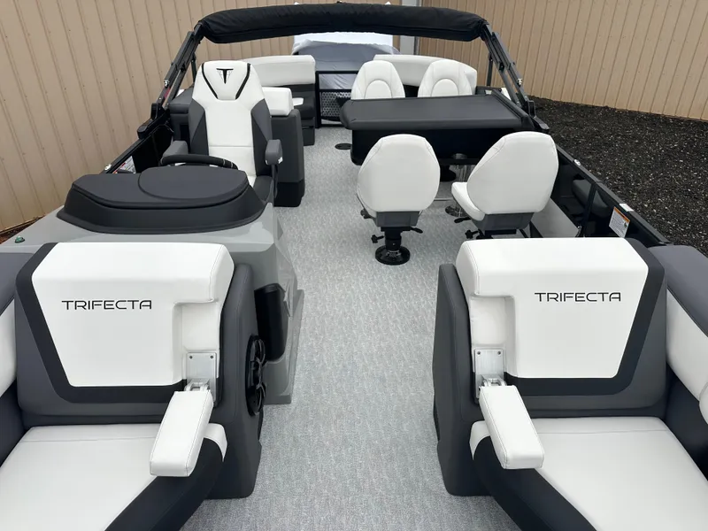 Slide: The Image of 2025 Trifecta 23 RFESS boat interior with white seating and modern design. - 7