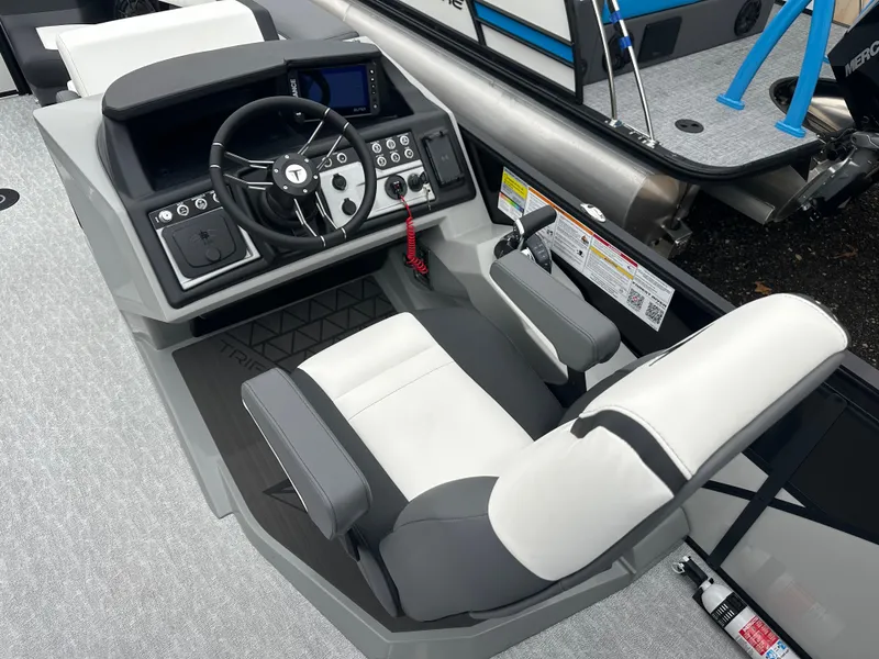 Slide: The Image of 2025 Trifecta 23 RFESS boat cockpit with modern steering and controls. - 8