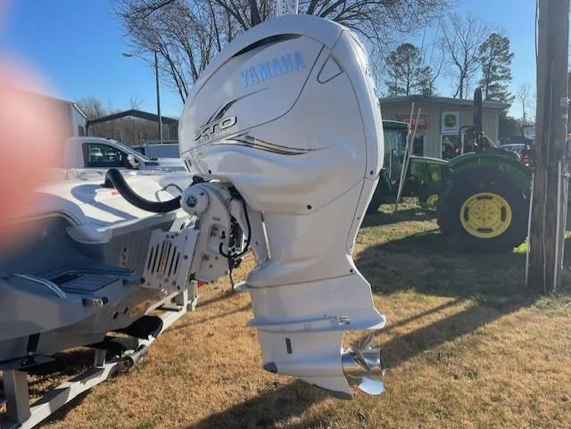 Slide: The Image of 2019 Tidewater 2700 Carolina Bay with Yamaha outboard motor in a sunny outdoor setting. - 21