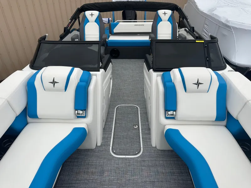 Slide: The Image of 2025 Berkshire 25 ULDCSTS boat interior with blue and white seating. - 4