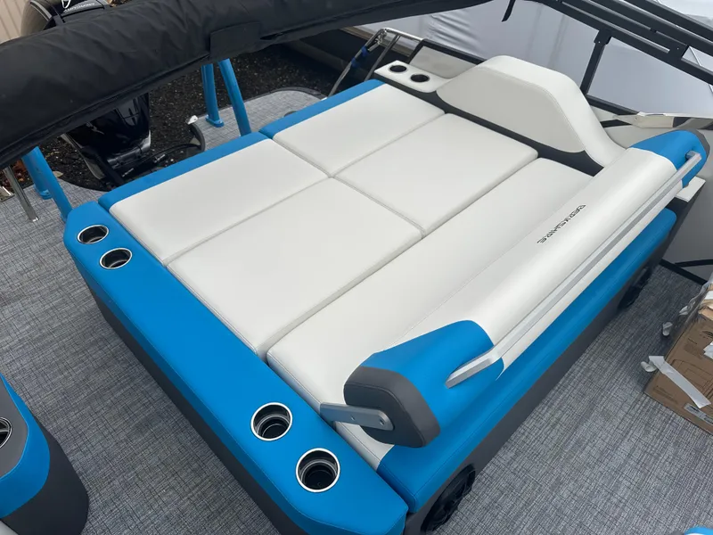 Slide: The Image of 2025 Berkshire 25 ULDCSTS boat seating with blue and white upholstery and cup holders. - 5