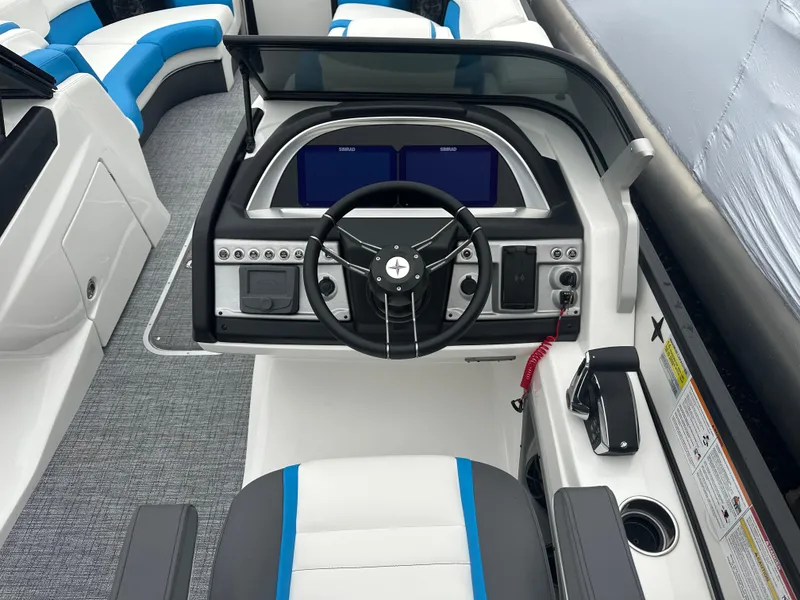 Slide: The Image of 2025 Berkshire 25 ULDCSTS boat dashboard with modern controls and sleek design. - 7