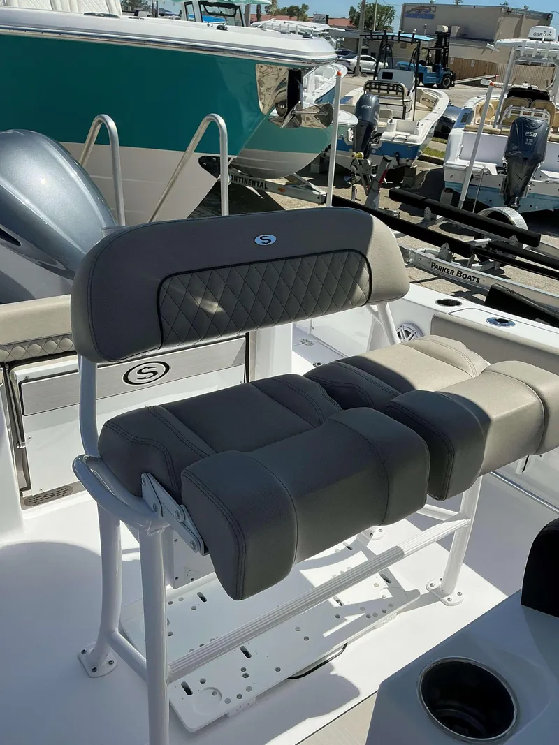 Slide: The Image of 2025 Sportsman 212 Open boat seating with gray cushioned seats and white frame. - 11