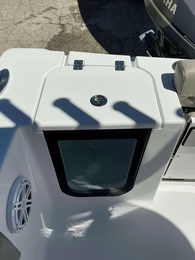 Slide: The Image of 2025 Sportsman 212 Open boat interior with storage compartment and speaker. - 13