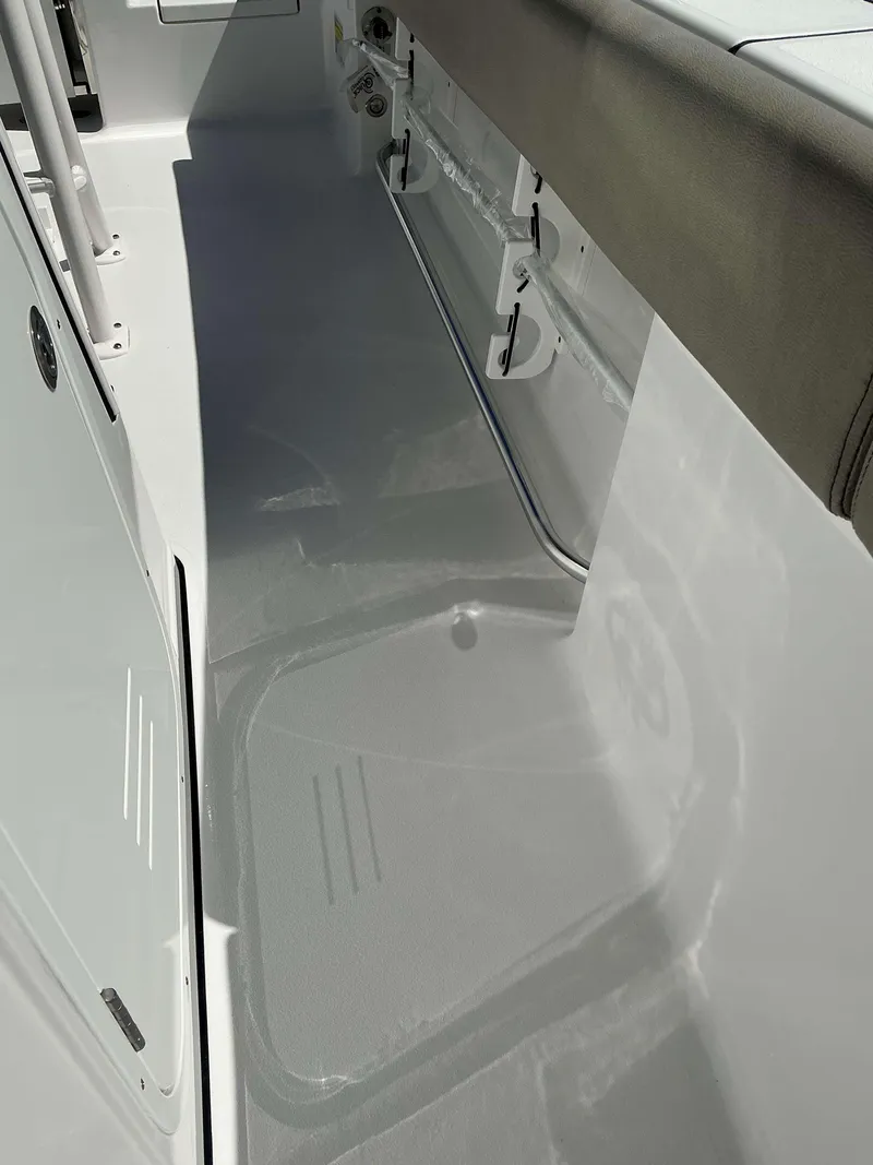 Slide: The Image of Interior view of 2025 Sportsman 212 Open boat, showcasing seating and deck features. - 14