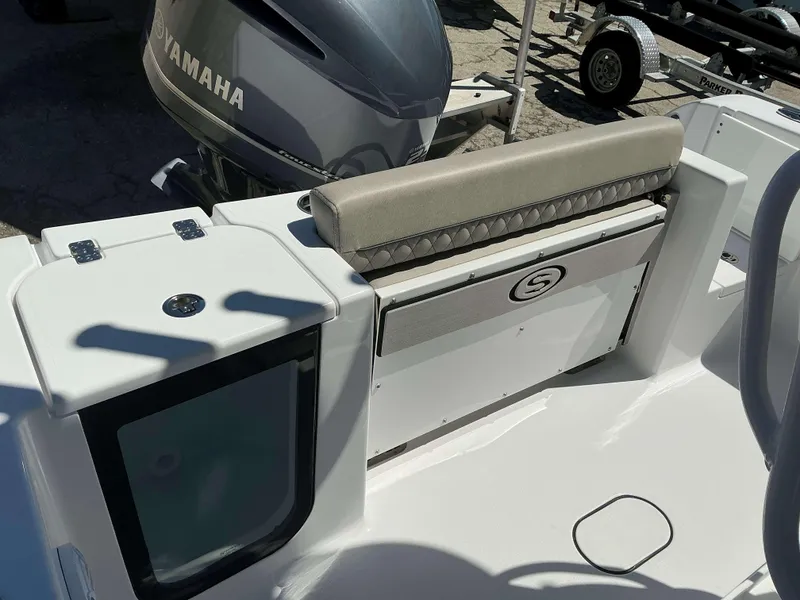 Slide: The Image of 2025 Sportsman 212 Open boat interior with Yamaha engine, featuring seating and storage. - 17