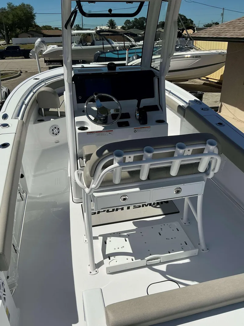 Slide: The Image of 2025 Sportsman 212 Open boat interior with steering console and seating. - 18
