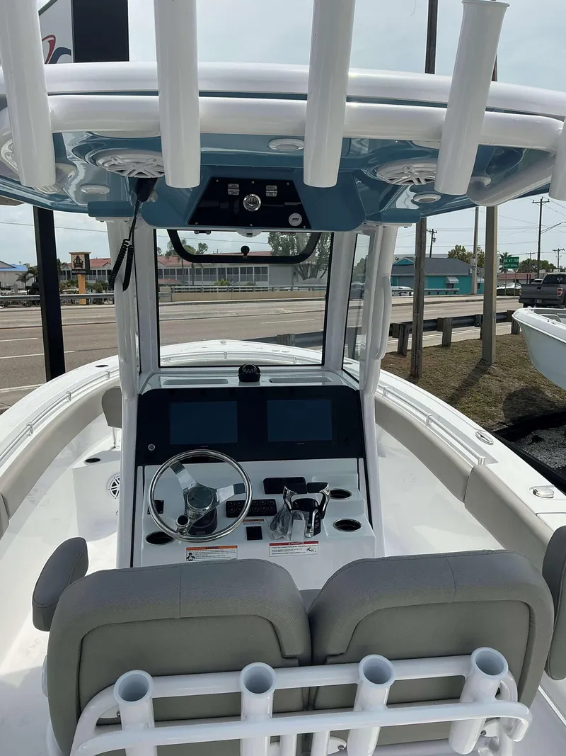 Slide: The Image of 2025 Sportsman 252 Open boat interior with modern dashboard and seating. - 11
