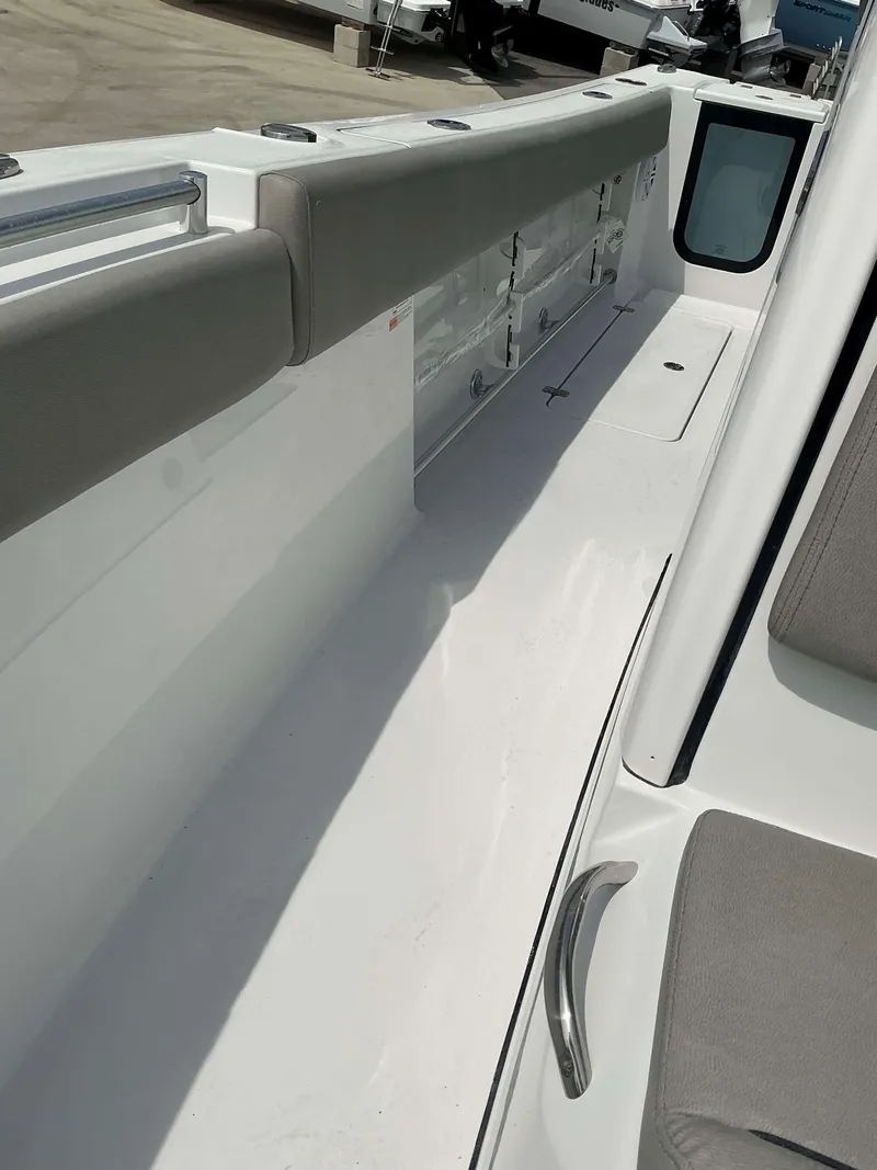 Slide: The Image of 2025 Sportsman 252 Open boat interior with cushioned seating and storage compartments. - 13