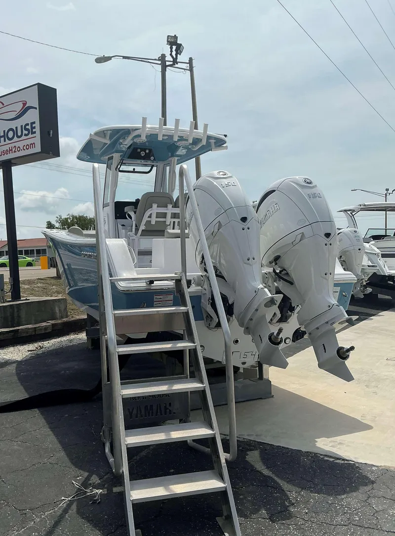 Slide: The Image of 2025 Sportsman 252 Open boat with dual Yamaha engines, displayed outdoors. - 3