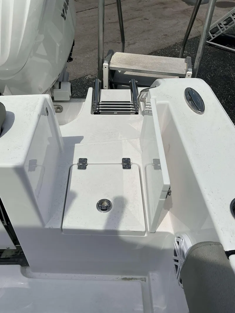 Slide: The Image of 2025 Sportsman 252 Open boat deck with ladder and storage compartment. - 5