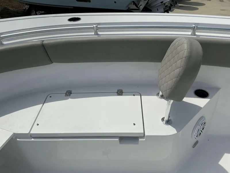 Slide: The Image of 2025 Sportsman 252 Open boat interior with cushioned seating and storage compartment. - 9