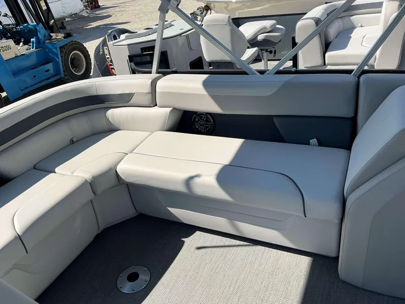 Slide: The Image of Interior of 2025 Sweetwater 2286 CSE pontoon boat with plush seating and modern design. - 11