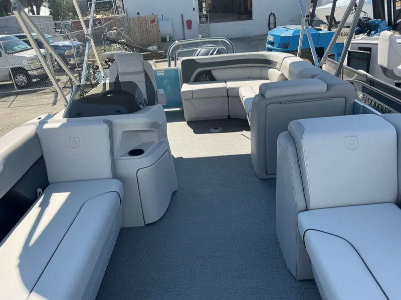 Slide: The Image of 2025 Sweetwater 2286 CSE pontoon boat interior with spacious seating and modern design. - 3