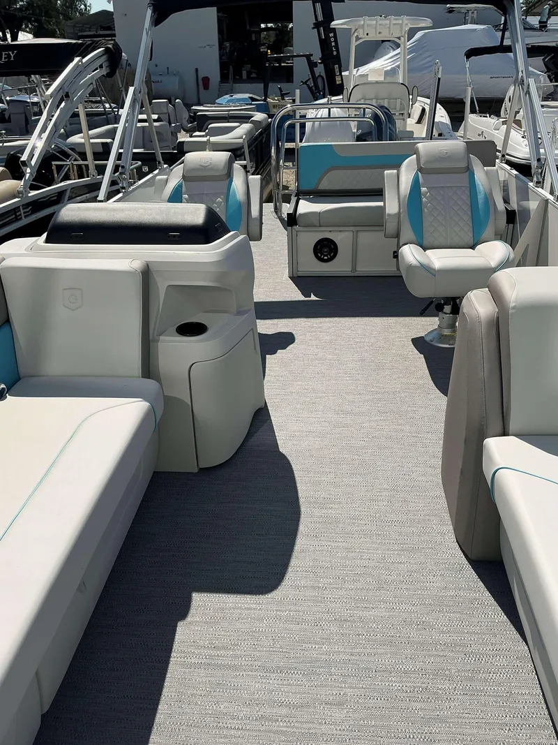 Slide: The Image of 2025 Sweetwater 2486 SFL pontoon boat interior with spacious seating and modern design. - 13