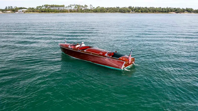 Slide: The Image of Custom 1995 Hugh Saint 34 Grand Prix boat on calm water, distant shoreline. - 12